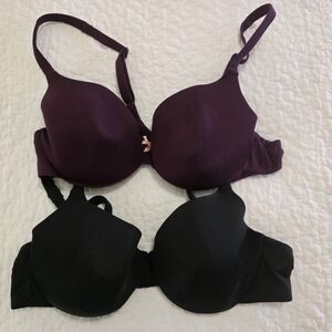 2 Lane Bryant Cacique bras, one black and one burgundy, lightly lined. See pics